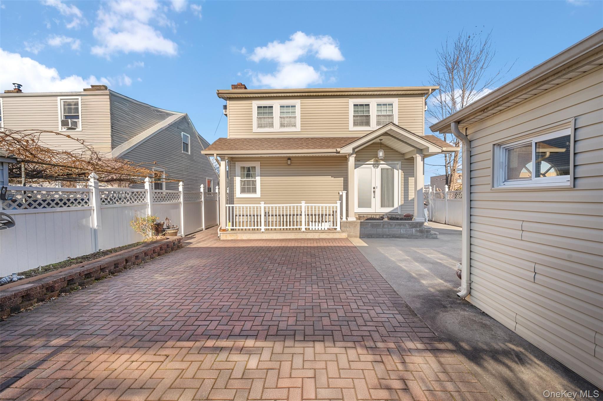 215 Rudolf Road Mineola, NY 11501 - Photo 8 of 14 a front view of a house with a yard