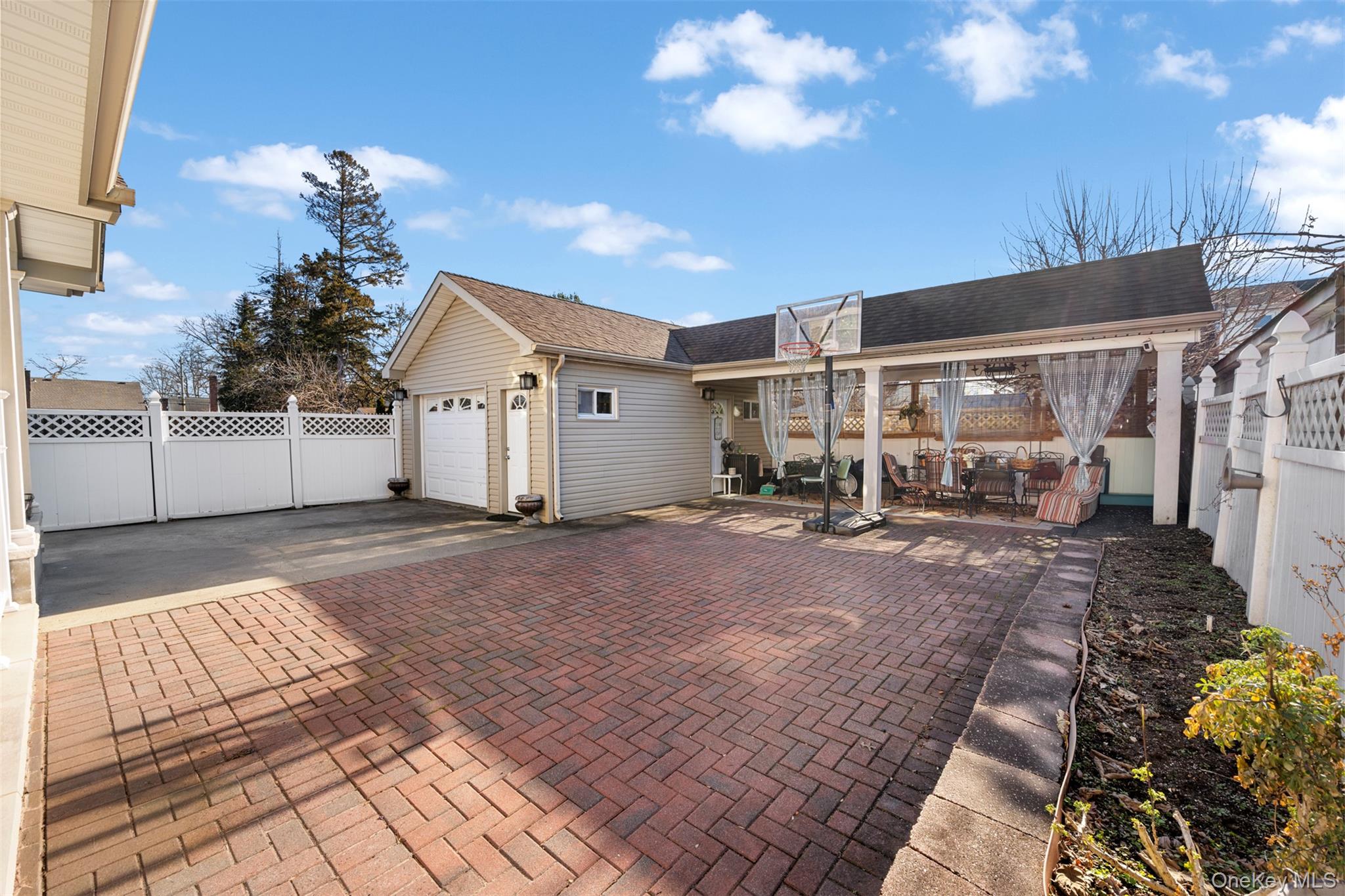 215 Rudolf Road Mineola, NY 11501 - Photo 10 of 14 a view of a house with a yard