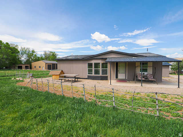 94 Spring Canyon Road Coalville, UT 84017 - Photo 4 of 50 Modern single-story residence with a metal roof and covered entry
