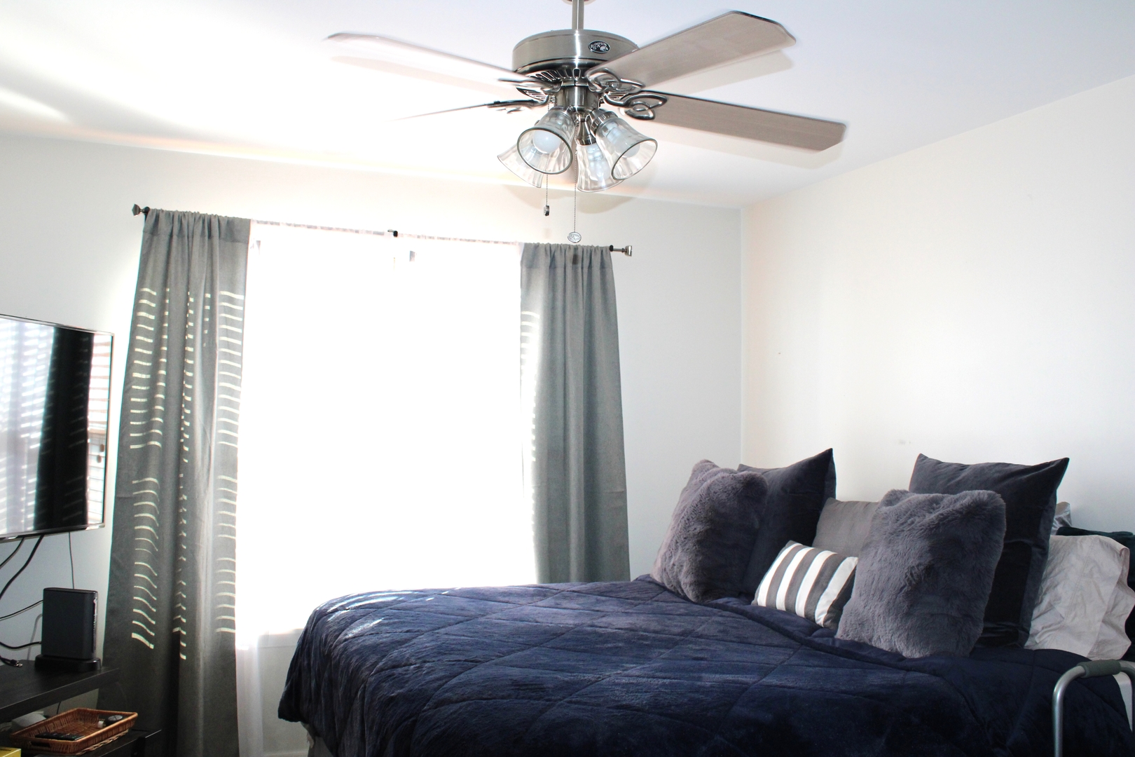 2560 Golf Ridge Circle, Unit 2560 Naperville, IL 60563 - Photo 8 of 16 a bedroom with a bed and a chandelier