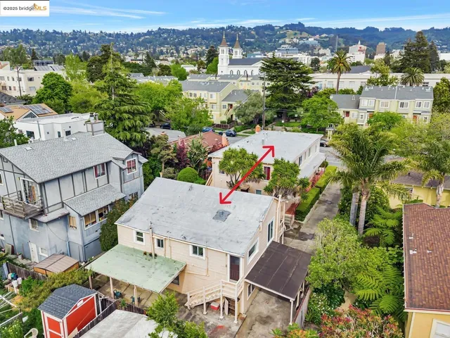 an aerial view of residential houses and outdoor space