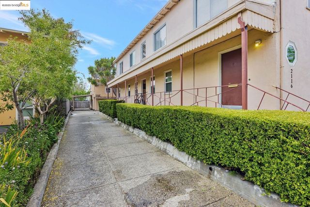 a view of a house with brick walls