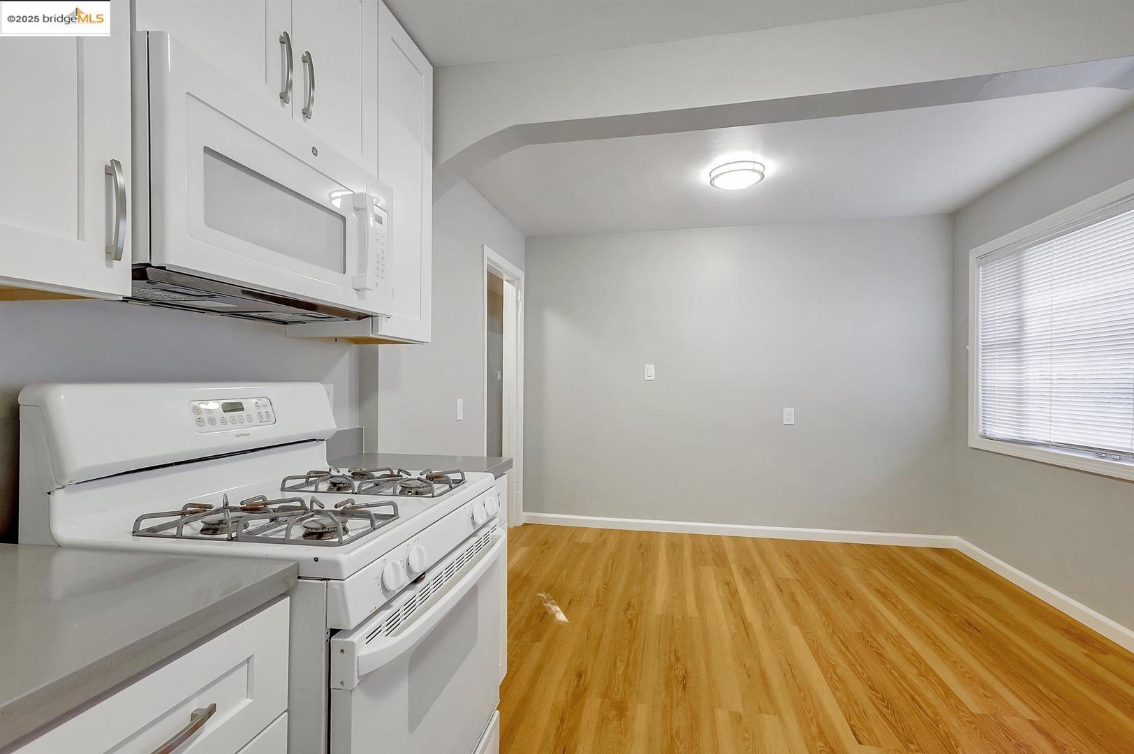 2118 California Street Berkeley, CA 94703 - Photo 26 of 34 a kitchen with a sink and a stove top oven