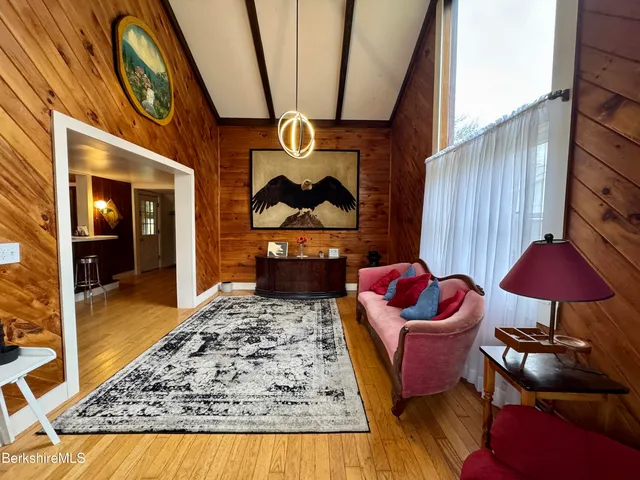 a living room with furniture and a rug