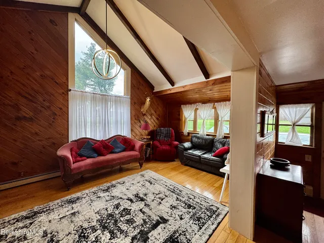 a living room with furniture and a rug
