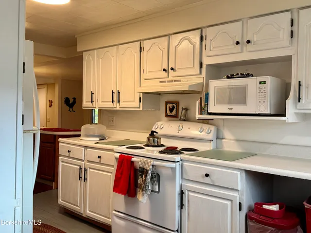 a kitchen with stainless steel appliances granite countertop a stove and a sink
