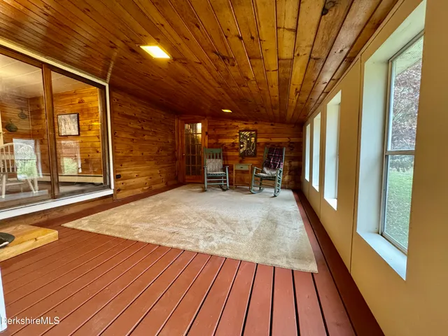 a view of outdoor space with wooden floor and furniture