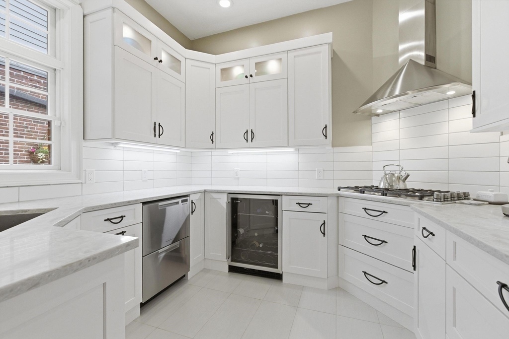 419 Main Street Boston, MA 02129 - Photo 10 of 41 a kitchen with white cabinets and white appliances
