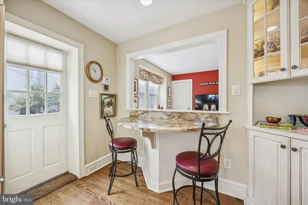 a view of a dining room with furniture and window