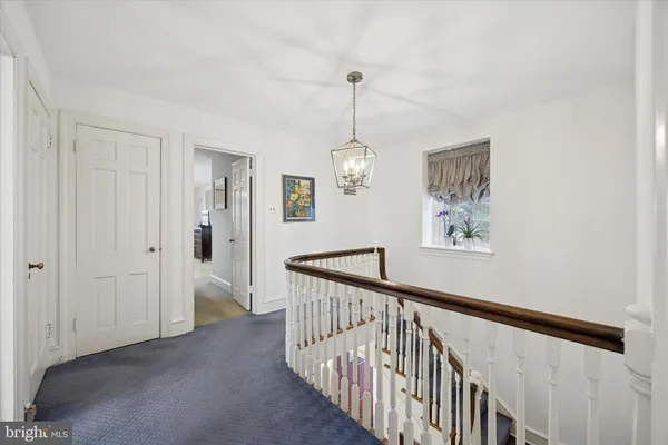 a view of a hallway with windows