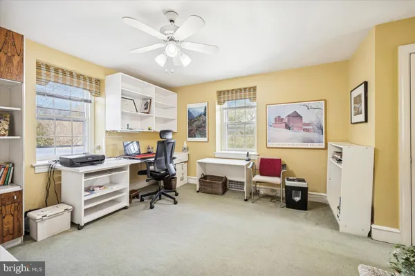 a view of a livingroom with furniture and a window