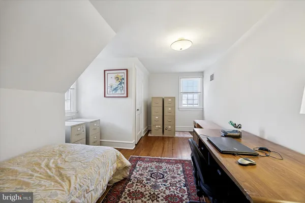 a bed room with a bed and a window