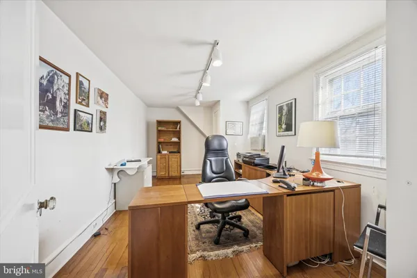 a workspace with furniture and window
