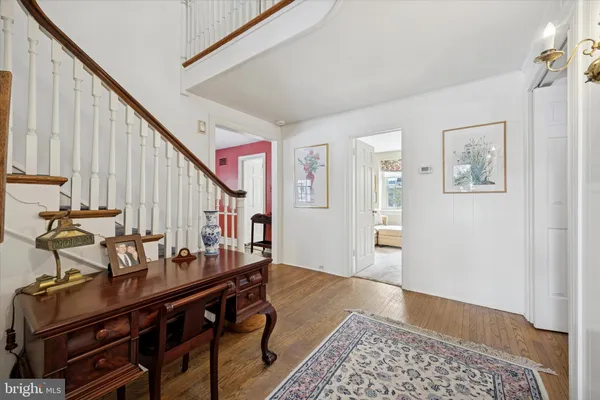 a view of an entryway with wooden floor