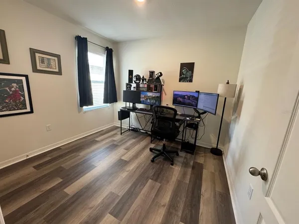 a workspace with furniture and a window