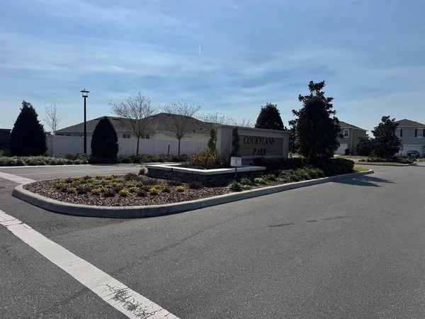 a view of a street with houses on the road