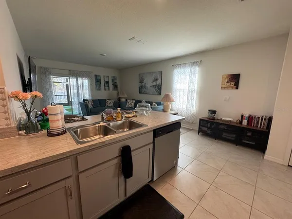 a kitchen with stainless steel appliances granite countertop a sink and a counter space