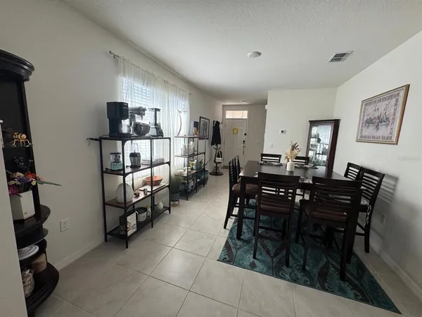 a kitchen with stainless steel appliances a refrigerator and a wooden cabinets