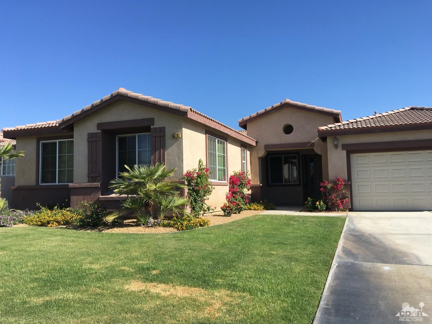 80722 Diamondback Trail Indio, CA 92201 - Photo 1 of 9 a front view of a house with a yard