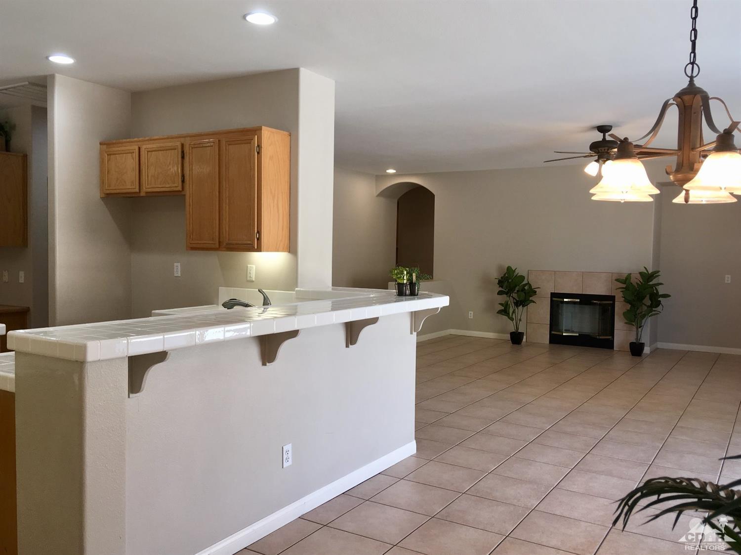 80722 Diamondback Trail Indio, CA 92201 - Photo 4 of 9 a view of kitchen with furniture and chandelier