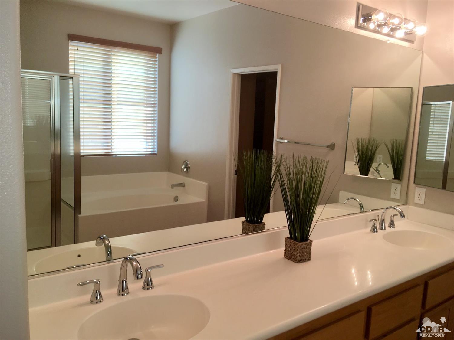 80722 Diamondback Trail Indio, CA 92201 - Photo 8 of 9 a bathroom with a sink and a mirror