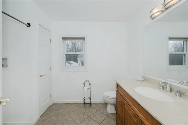 a bathroom with a sink toilet and vanity
