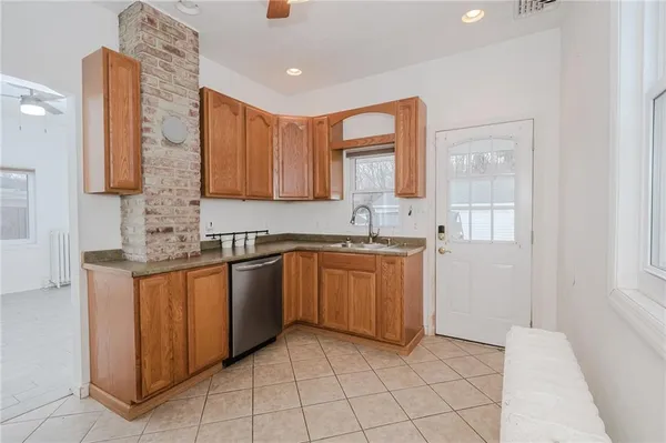 a kitchen with stainless steel appliances granite countertop a sink and cabinets