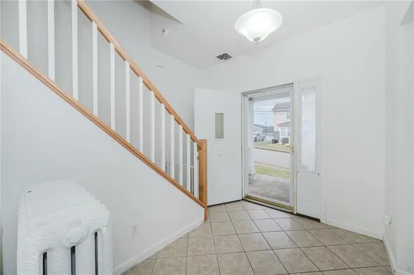 a view of a hallway with staircase