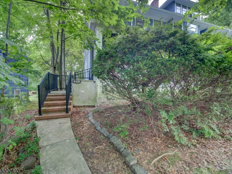 449 Grove Street Montclair, NJ 07043 - Photo 15 of 23 a view of a yard with plants and a fountain