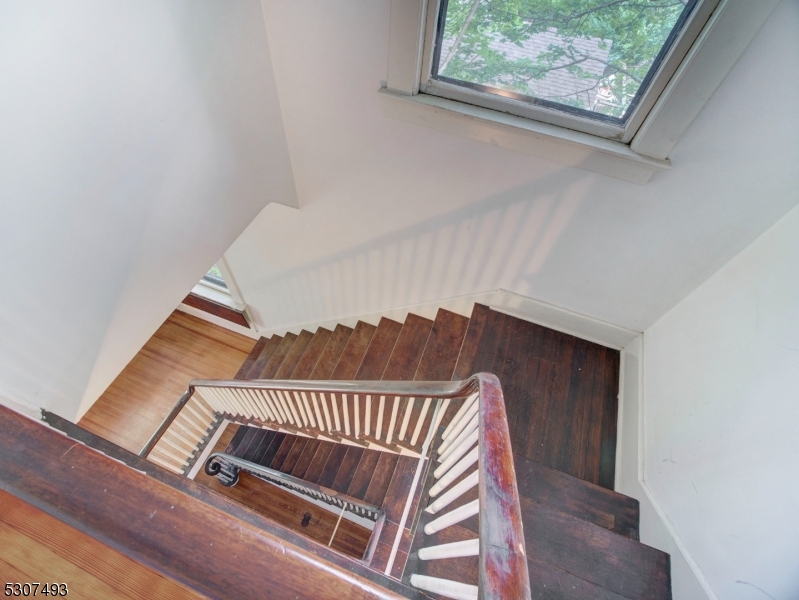 449 Grove Street Montclair, NJ 07043 - Photo 19 of 23 a view of staircase with railing and a window