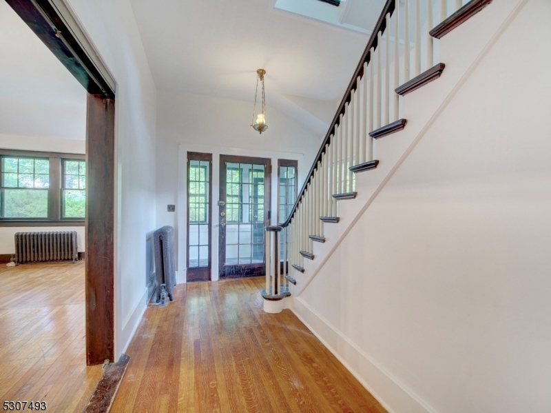 449 Grove Street Montclair, NJ 07043 - Photo 5 of 23 a view of entryway and hall with wooden floor