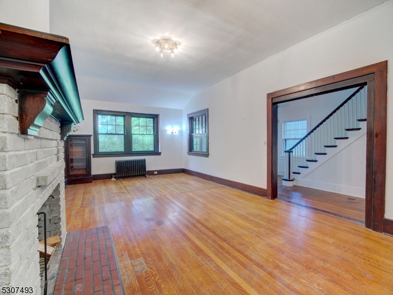 449 Grove Street Montclair, NJ 07043 - Photo 6 of 23 a view of empty room with wooden floor and fan