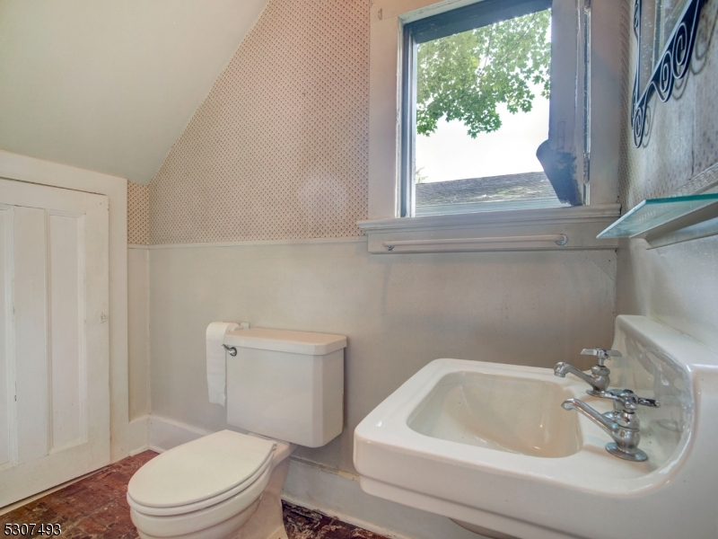449 Grove Street Montclair, NJ 07043 - Photo 10 of 23 a bathroom with a sink a toilet and a bathtub