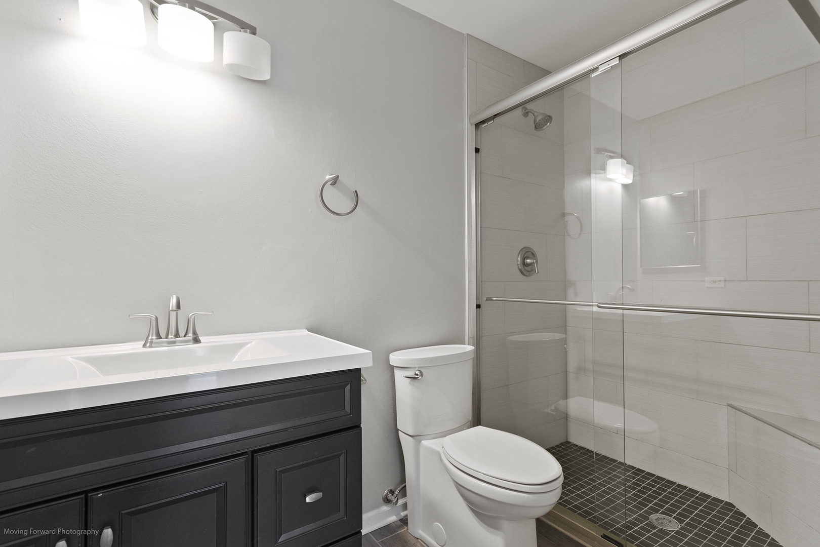 3473 Ravinia Circle Aurora, IL 60504 - Photo 14 of 17 a bathroom with a sink a toilet and shower