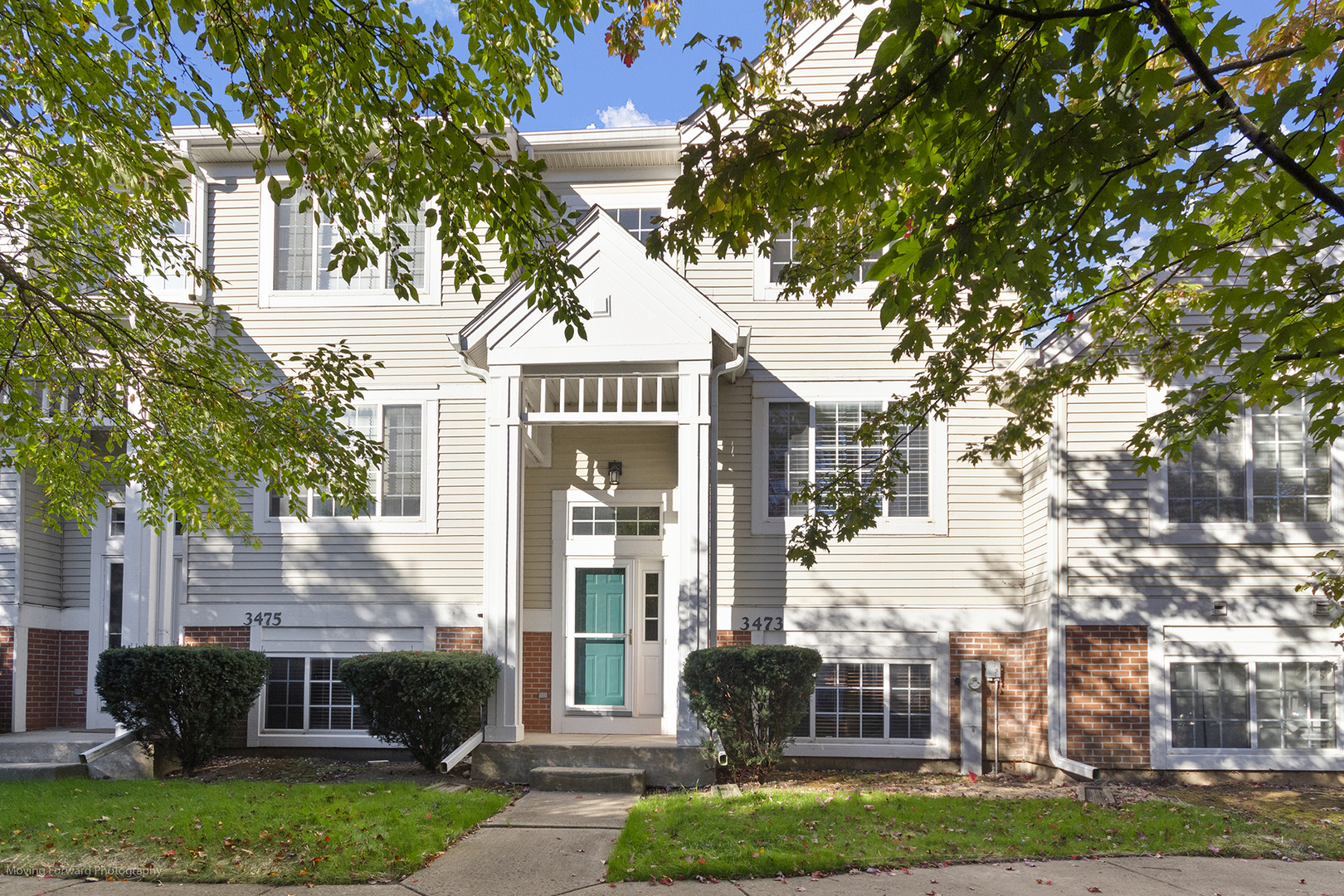 3473 Ravinia Circle Aurora, IL 60504 - Photo 2 of 17 a front view of a house with a yard and potted plants