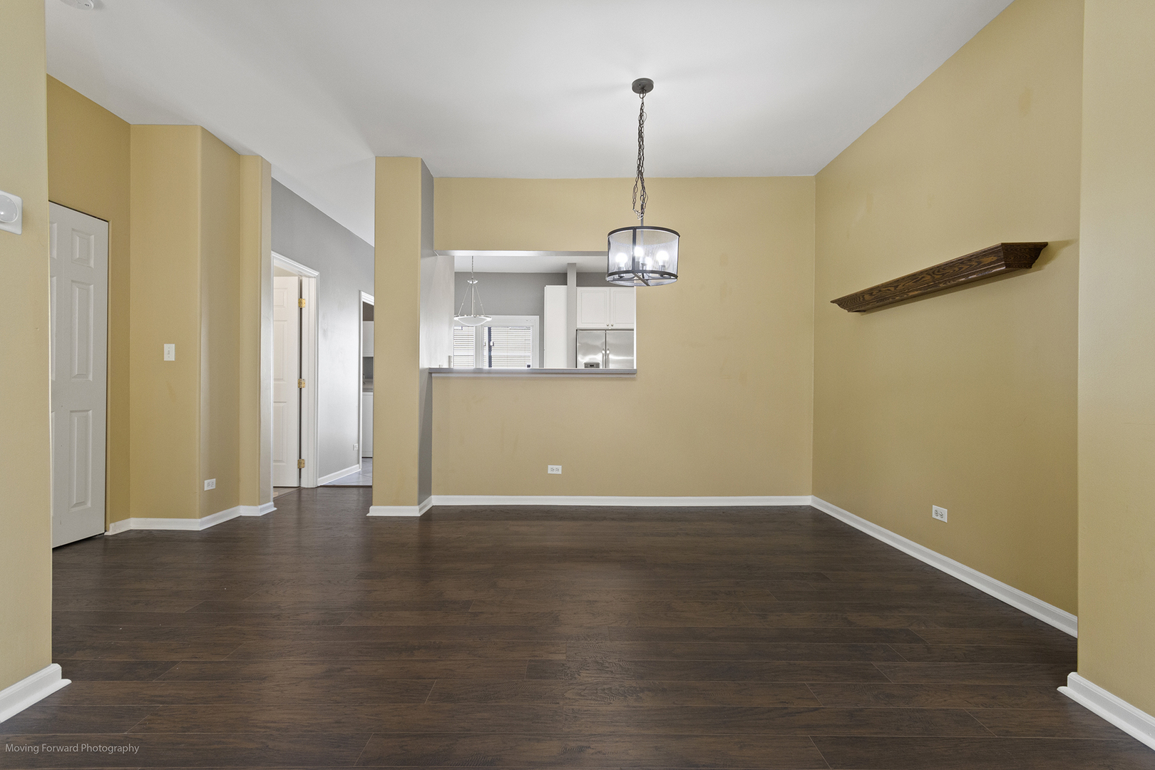 3473 Ravinia Circle Aurora, IL 60504 - Photo 8 of 17 a view of an empty room with wooden floor and a window