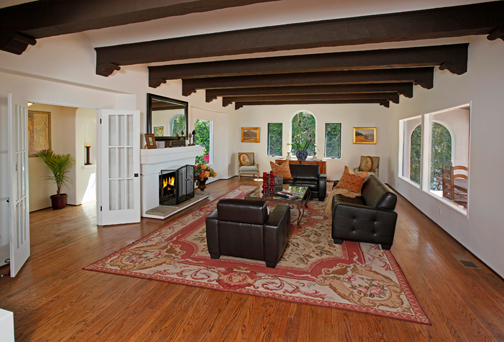 401 Las Alturas Road Santa Barbara, CA 93103 - Photo 17 of 18 a living room with furniture large windows and a fireplace