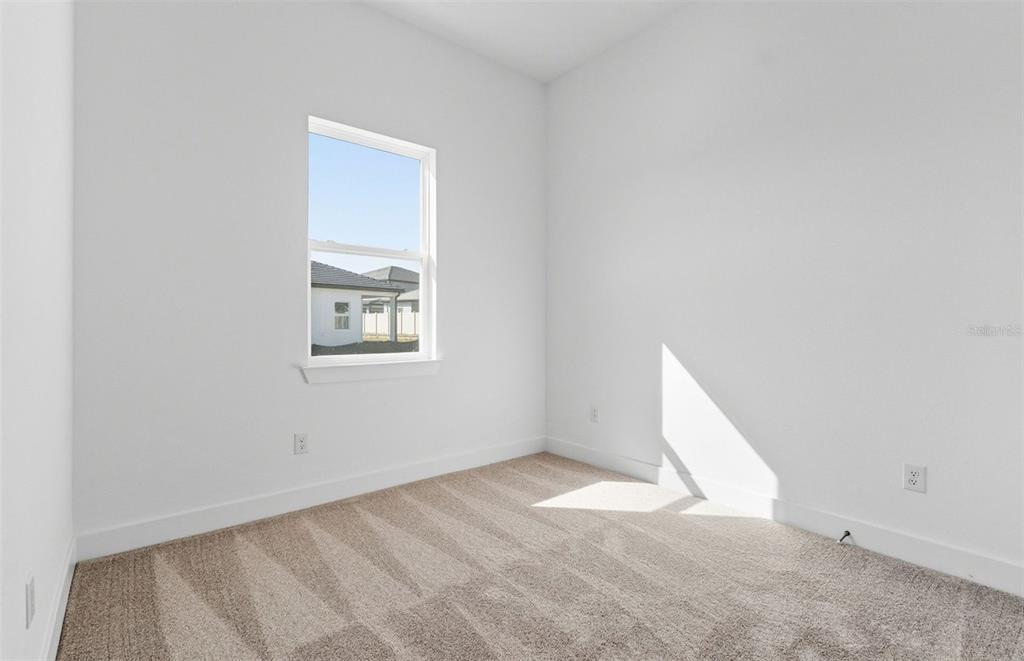 1683 Valier Point Zephyrhills, FL 33541 - Photo 13 of 20 an empty room with a window