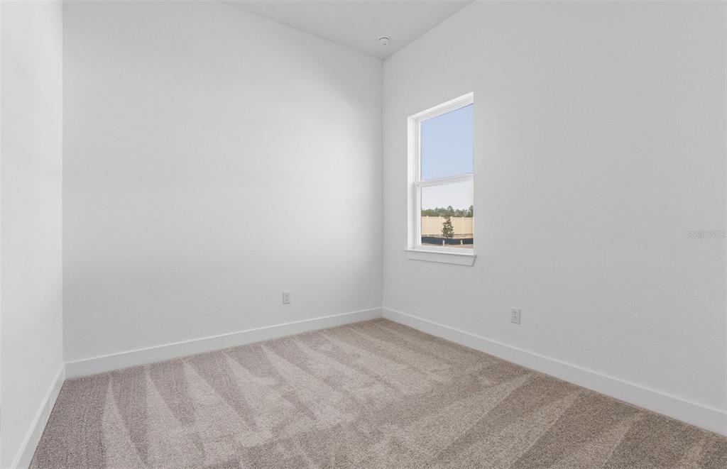 1683 Valier Point Zephyrhills, FL 33541 - Photo 15 of 20 an empty room with a window