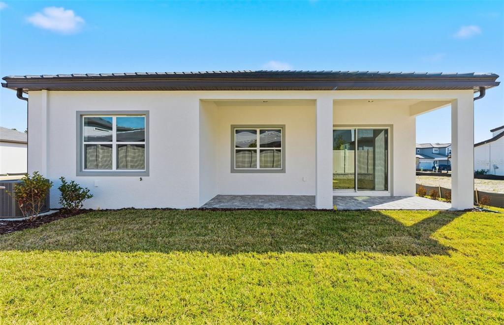 1683 Valier Point Zephyrhills, FL 33541 - Photo 17 of 20 a view of a house with swimming pool and porch