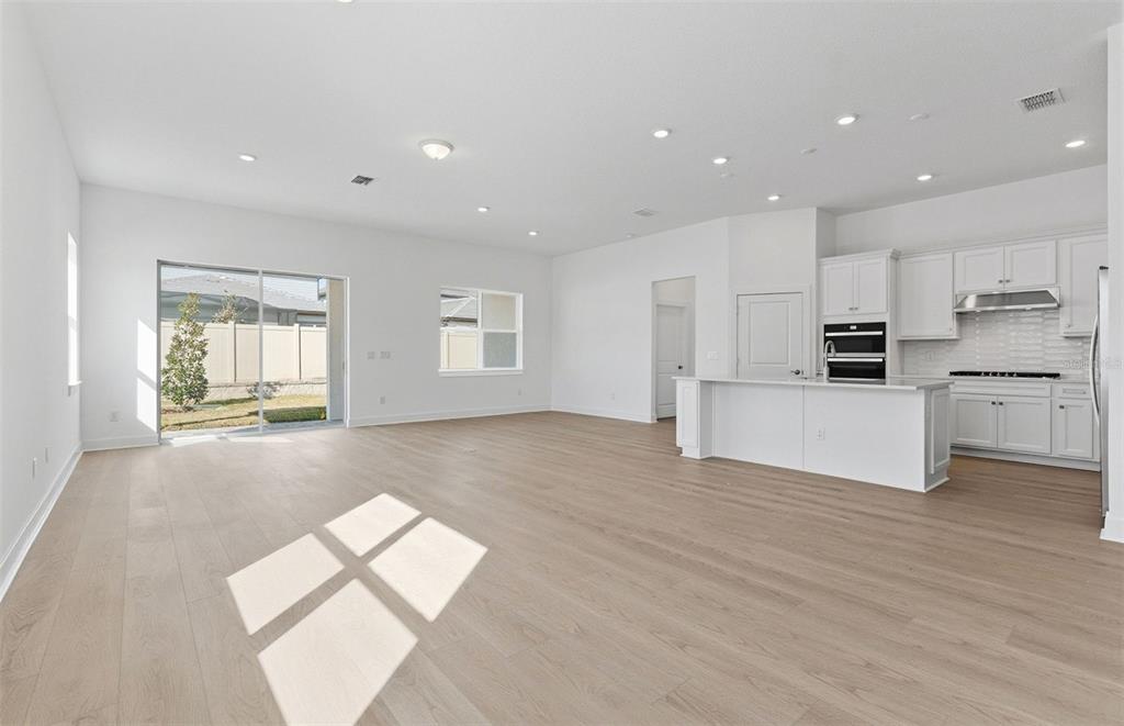 1683 Valier Point Zephyrhills, FL 33541 - Photo 6 of 20 a view of a kitchen with microwave and cabinets