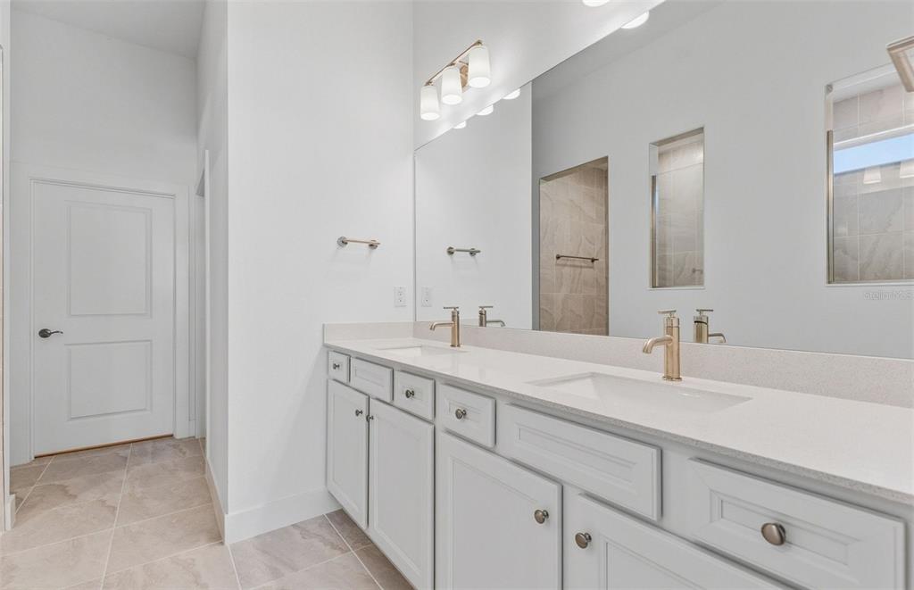 1683 Valier Point Zephyrhills, FL 33541 - Photo 8 of 20 a bathroom with a sink and a mirror