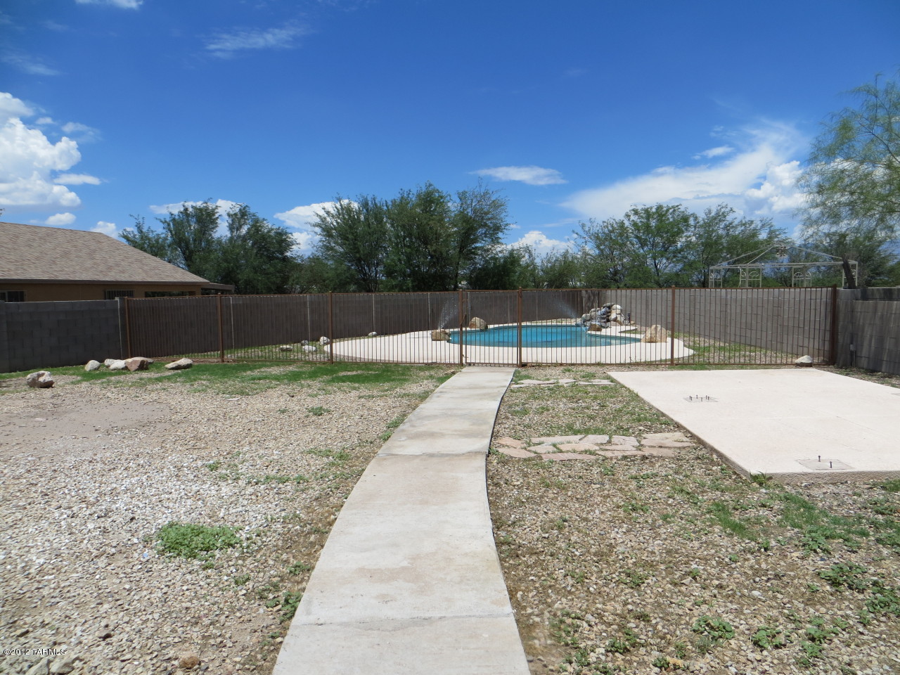 4361 Via Rio Azul South Tucson, AZ 85714 - Photo 13 of 18 a view of swimming pool with a yard