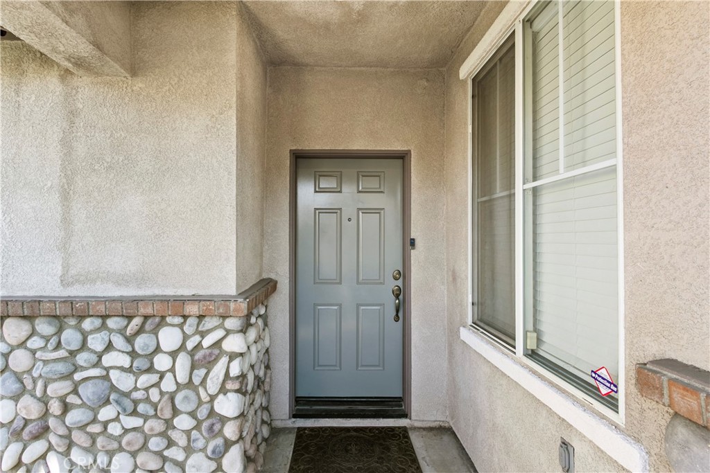 6837 Cosmos Street Chino, CA 91710 - Photo 2 of 36 a view of a door and a window