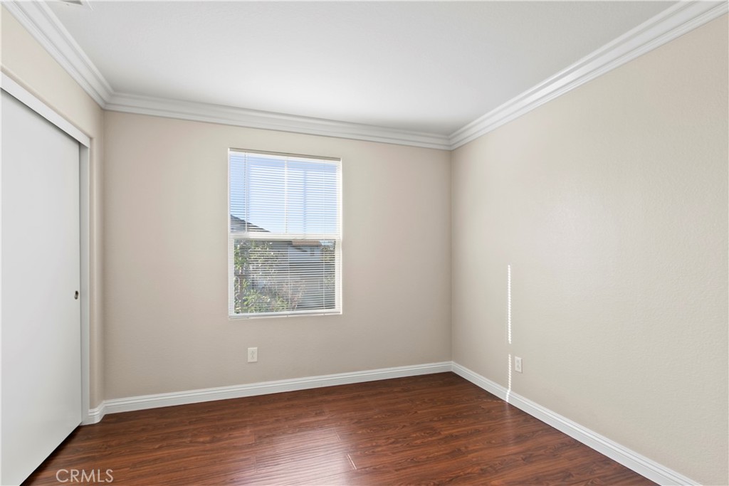 6837 Cosmos Street Chino, CA 91710 - Photo 22 of 36 an empty room with wooden floor and windows