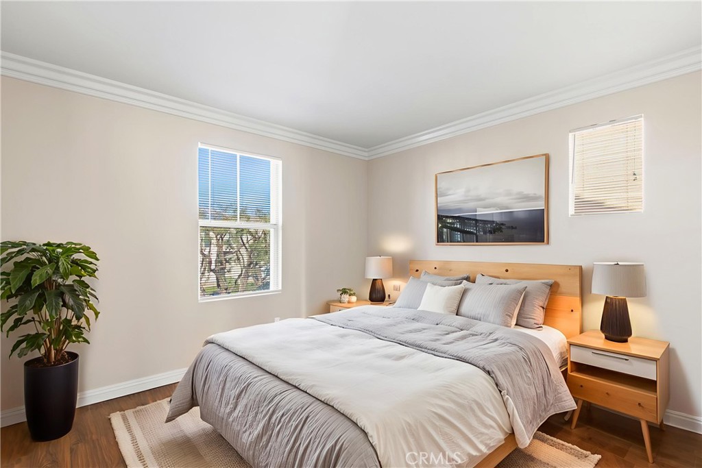 6837 Cosmos Street Chino, CA 91710 - Photo 25 of 36 a bedroom with a bed and a potted plant