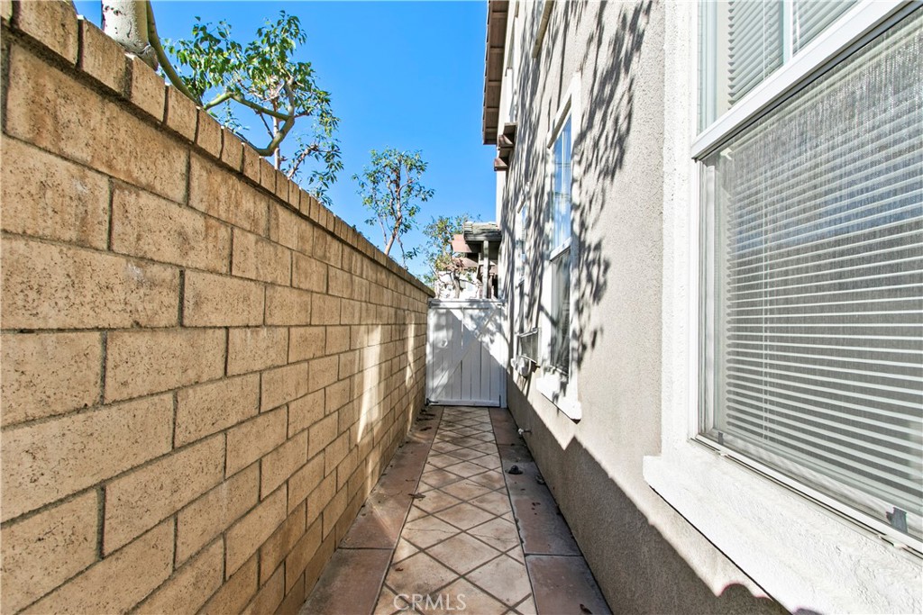 6837 Cosmos Street Chino, CA 91710 - Photo 28 of 36 a view of a pathway with a tree in front of it