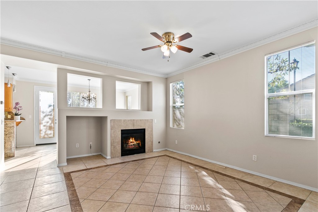 6837 Cosmos Street Chino, CA 91710 - Photo 3 of 36 a view of an empty room with window and fire place