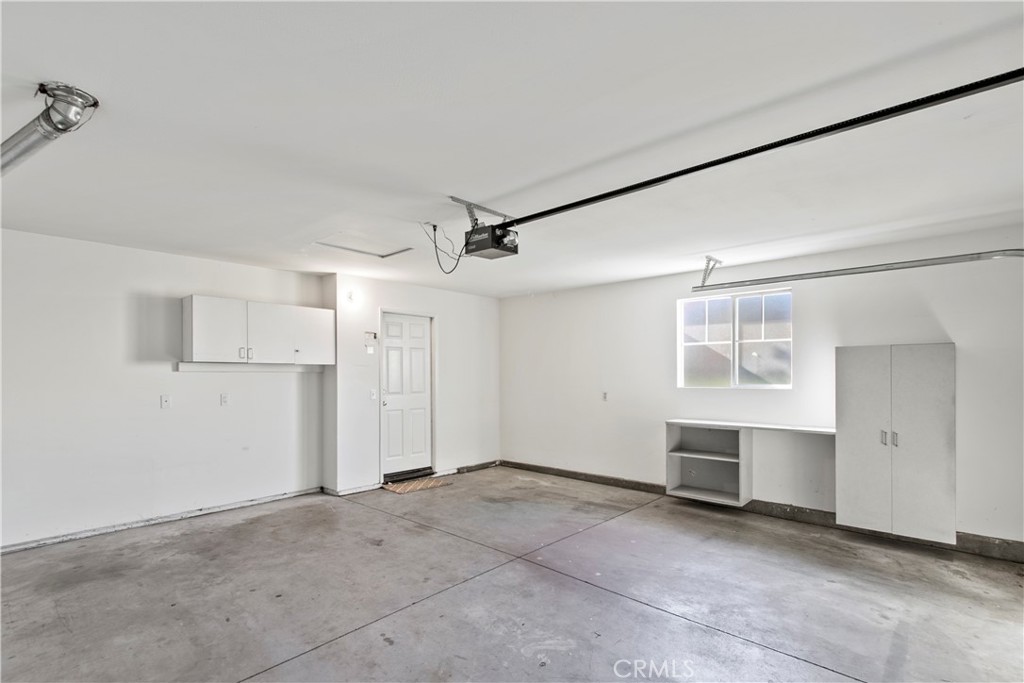 6837 Cosmos Street Chino, CA 91710 - Photo 31 of 36 a view of empty room with cabinet and windows