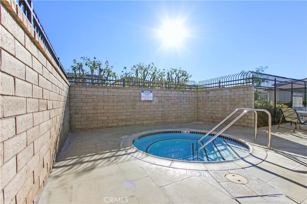 6837 Cosmos Street Chino, CA 91710 - Photo 35 of 36 a view of a swimming pool with a lake